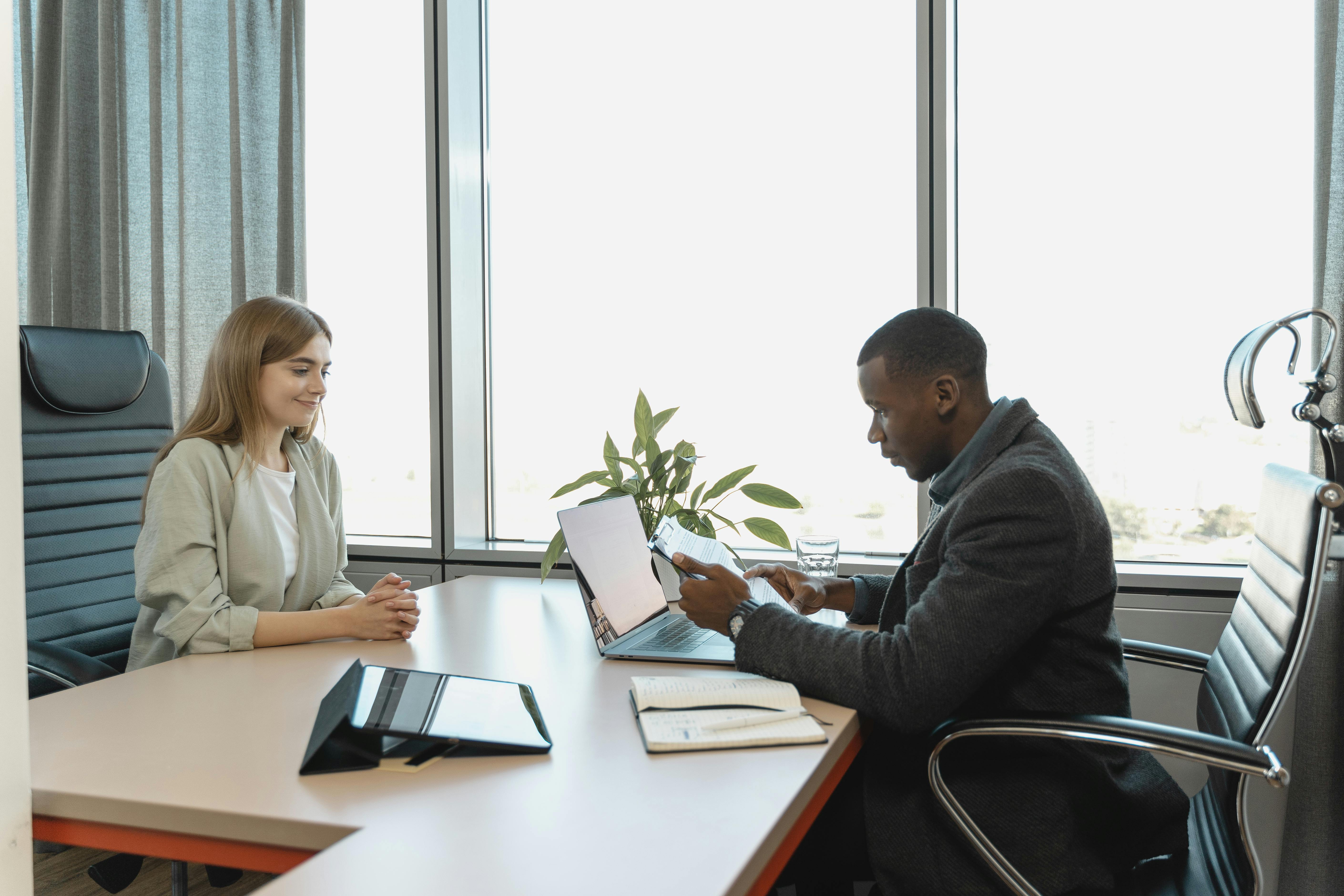 Recruiter interviewing a candidate in a professional office